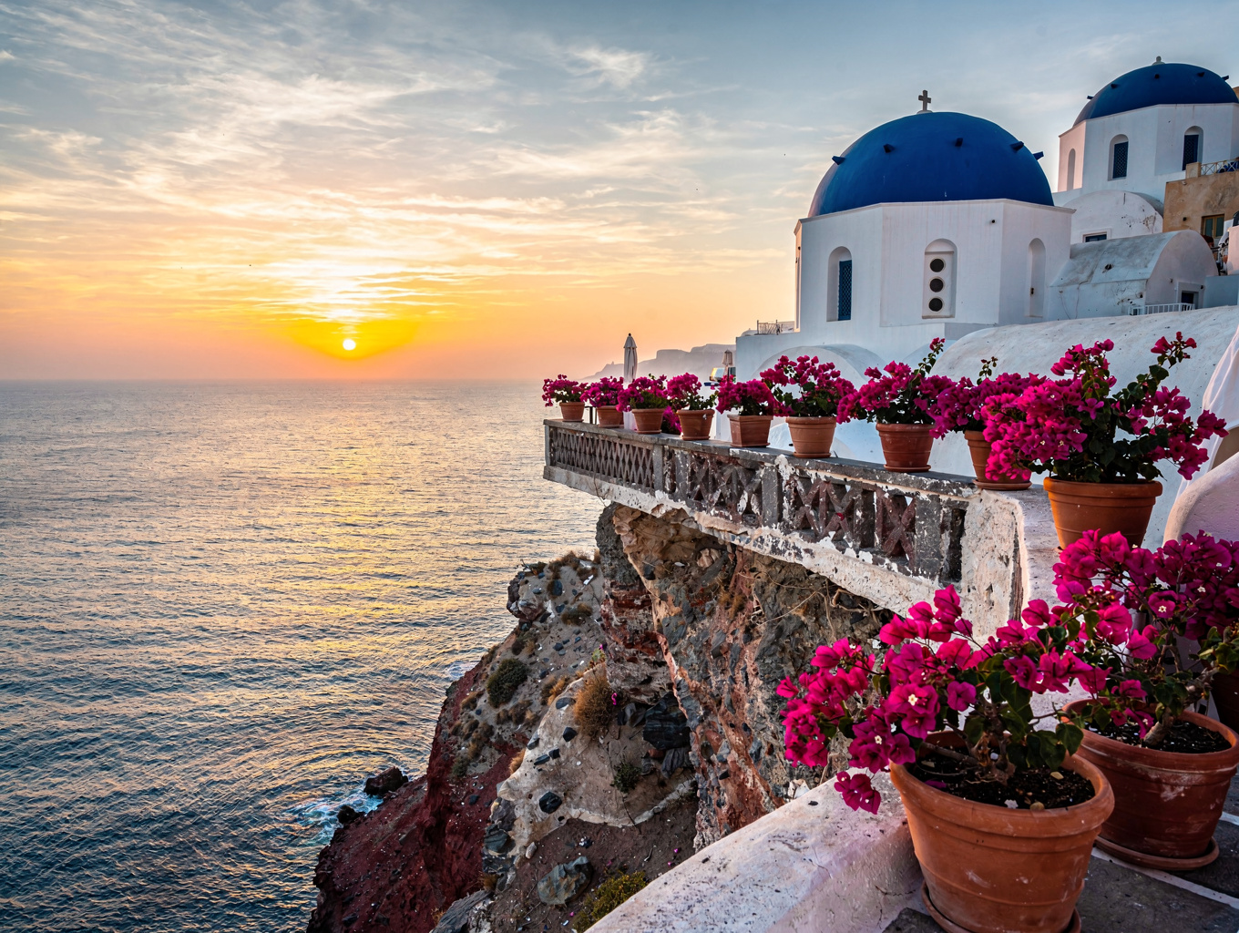 Sunlit resort balconies and scenic destinations on special offer in Santorini